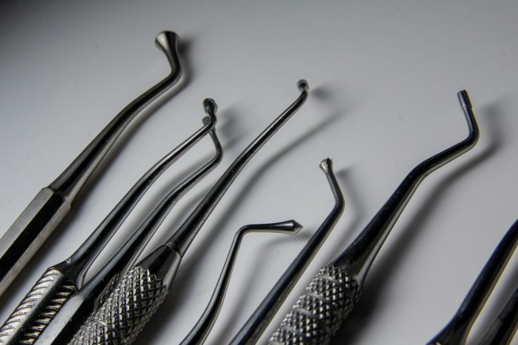 a-group-of-dental-tools-sitting-on-top-of-a-table-t3z9mibv-ky