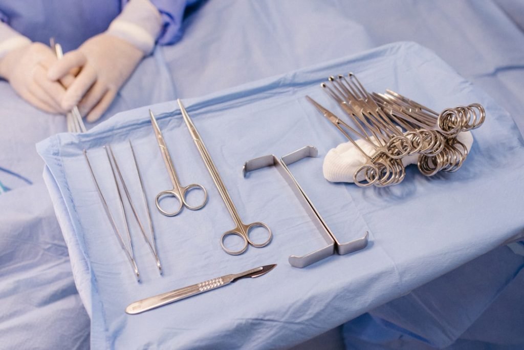 a-hospital-bed-with-surgical-equipment-on-top-of-it-ar1cmqsbqt4